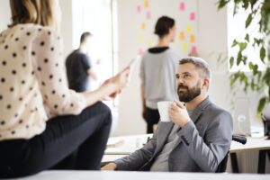 Business people with wheelchair in the office.