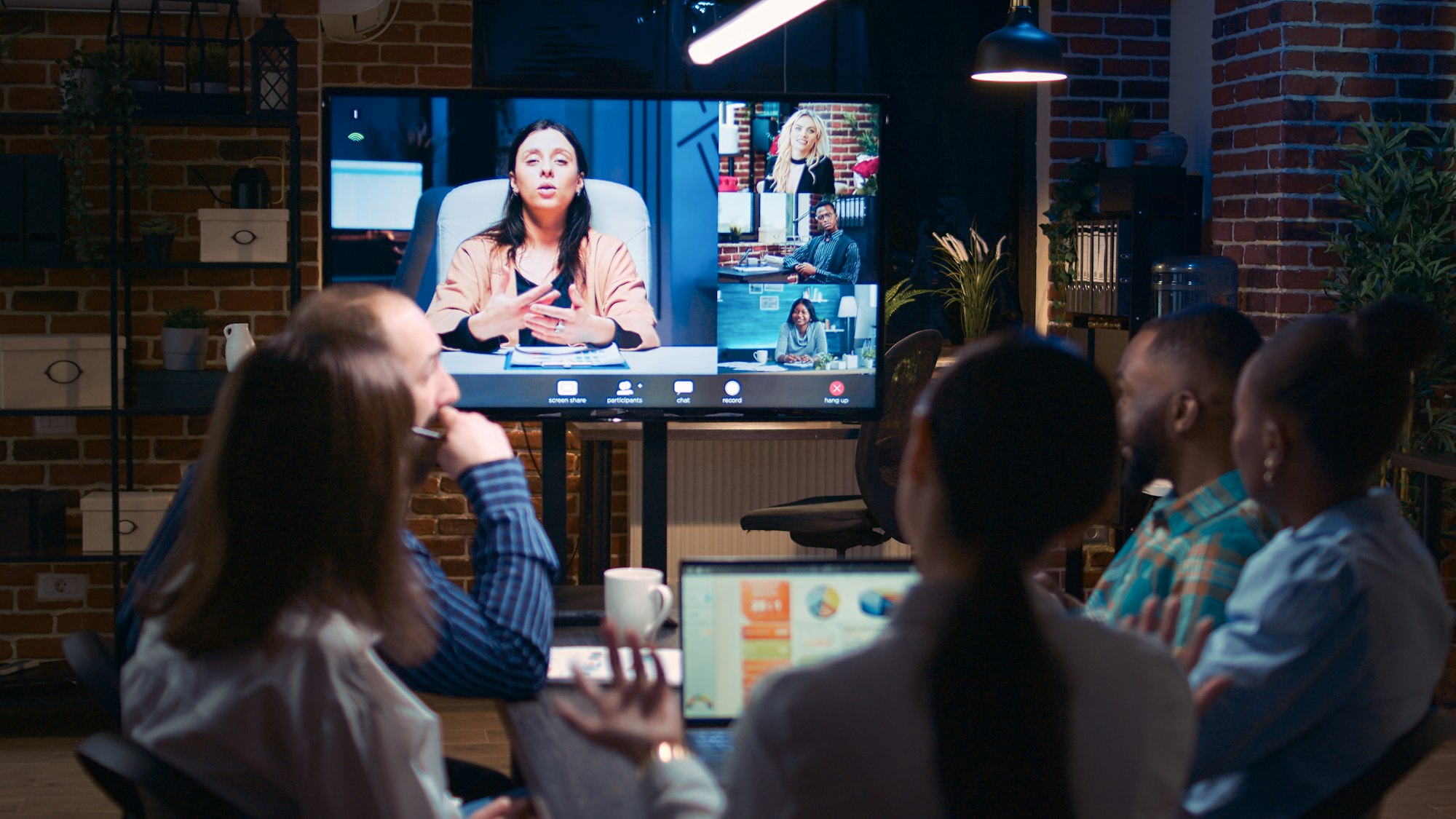 Employees and remote team company revenue discussion in videconference