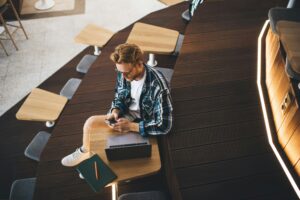 Guy working or studying in coworking office space